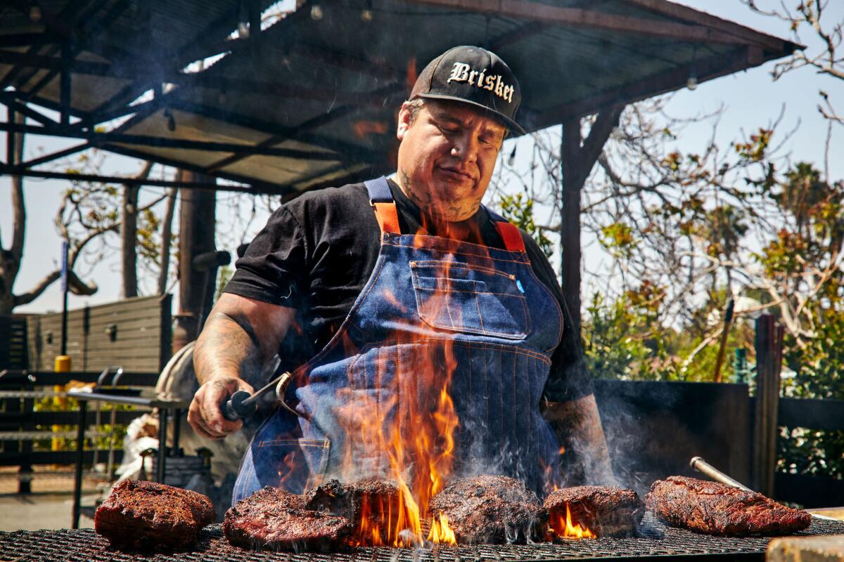 Pitmaster Daniel Castilla mans the grill at Heritage Barbecue & Brewery in San Juan Capistrano.  