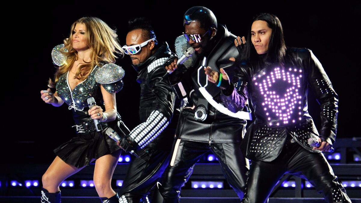 Fergie, apl.de.ap, will.i.am and Taboo of the Black Eyed Peas perform during the 2011 Super Bowl halftime show.