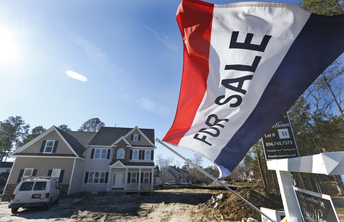 A flag advertises a newly built home for sale in Richmond, Va.