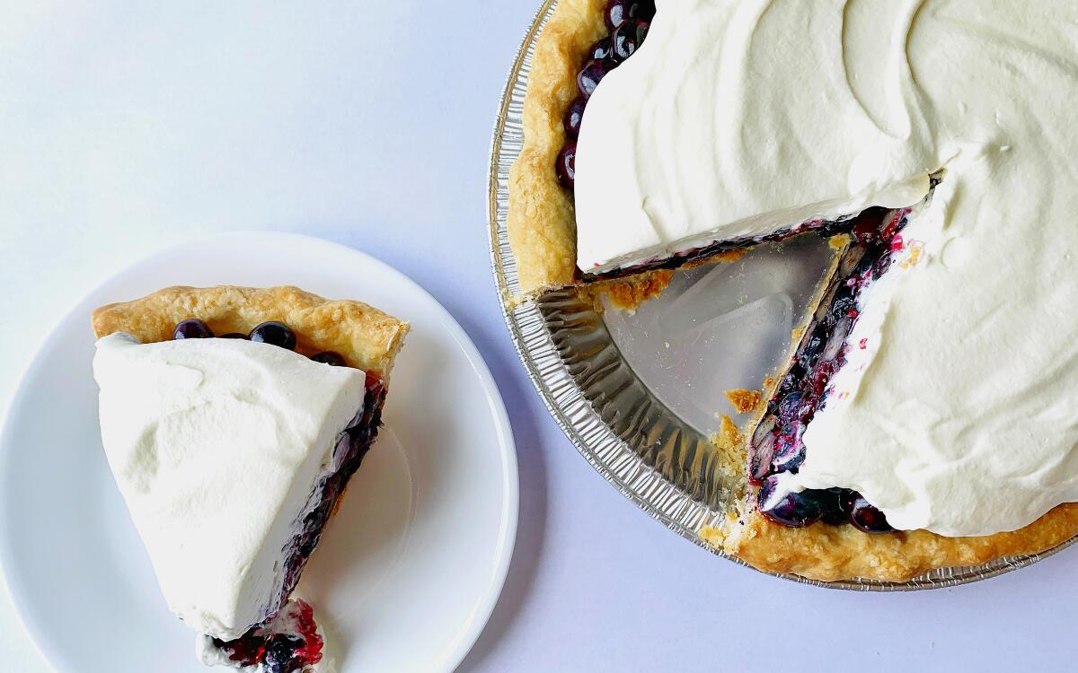 Fresh, raw blueberries pile into a crisp pastry crust and get a blanket of whipped cream in this refreshing summer berry pie.