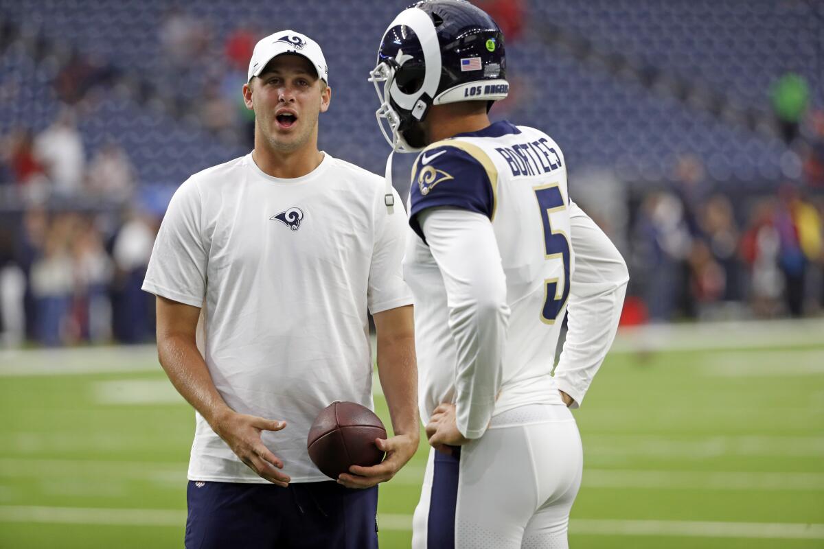 Rams quarterback Jared Goff, left, speaks with backup signal-caller Blake Bortles before Thursday's win over the Houston Texans.