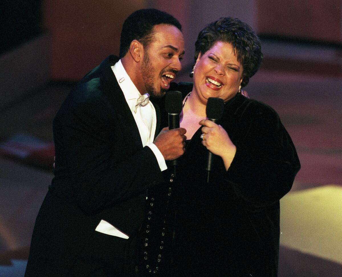 James Ingram, left, performs with Patti Austin in Pasadena in 1997. Ingram's death was announced Tuesday.