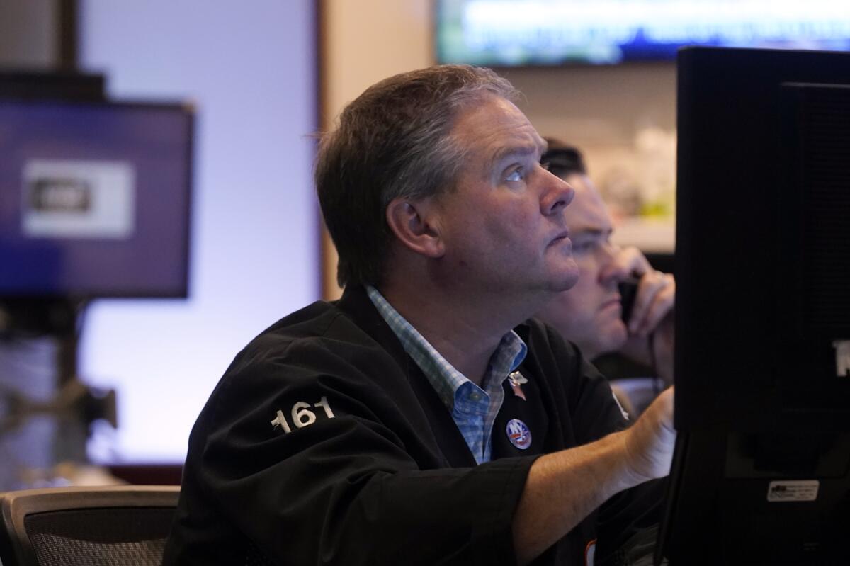 Traders work on the floor of the New York Stock Exchange on July 13. 