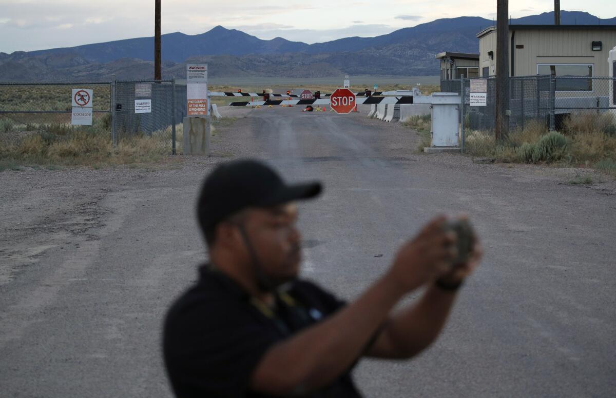 Terris Williams visits an entrance to the Nevada Test and Training Range near Area 51 in Nevada