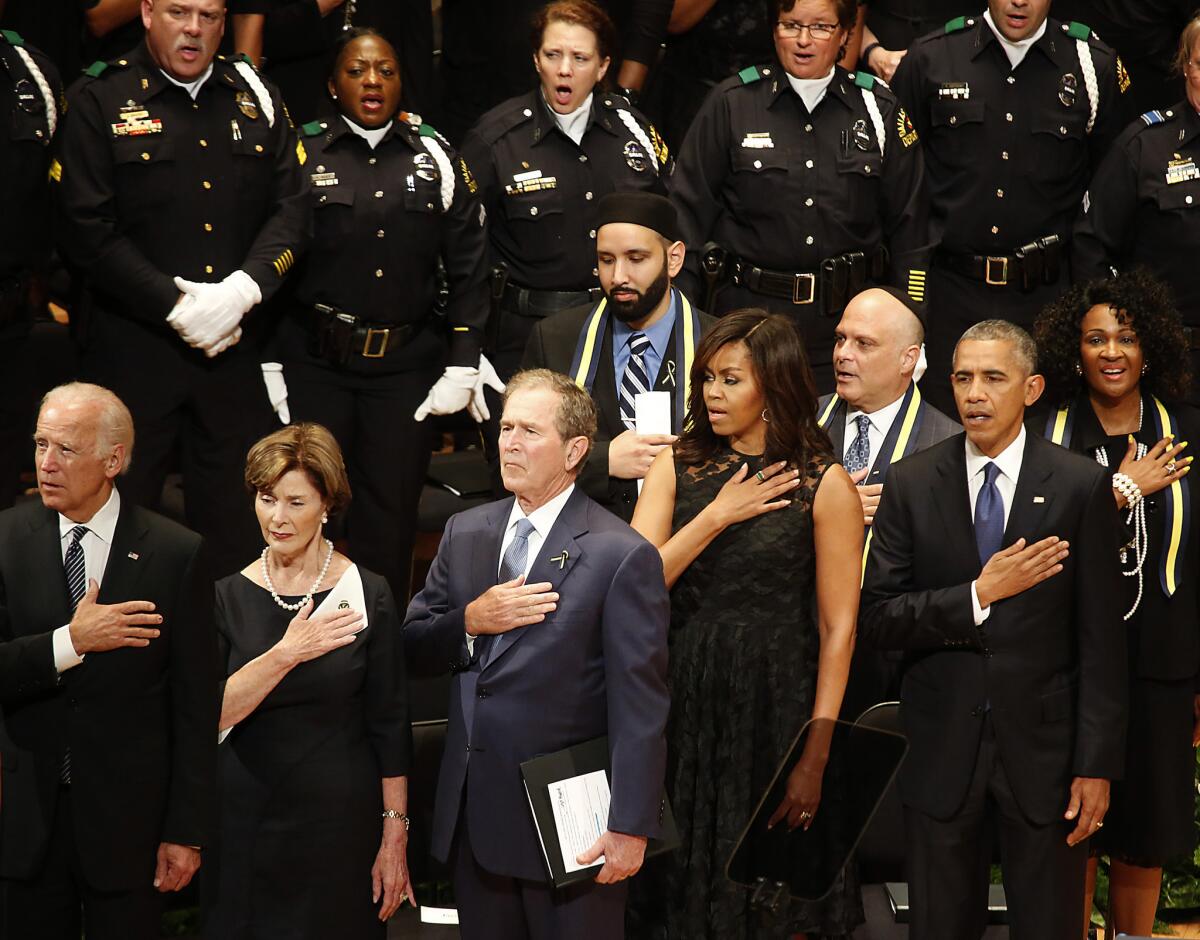 Vice President Joe Biden, left, former First Lady Laura Bush, former President George W. Bush, First Lady Michelle Obama and President Obama at a memorial service in Dallas.