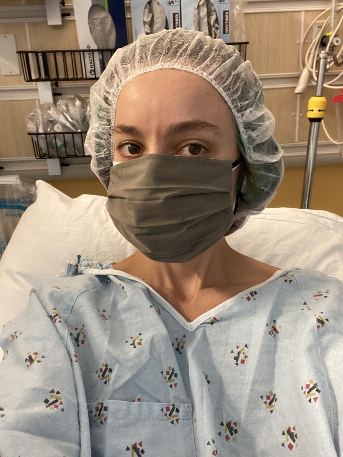 Katie McKnight wearing a mask and hospital gown