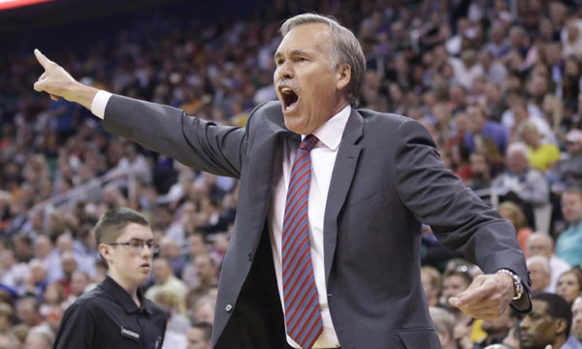 Lakers Coach Mike D'Antoni reacts to a call during the second half of the team's 119-104 win over the Utah Jazz on Monday. Are the Lakers planning to keep D'Antoni for the 2014-15 season?