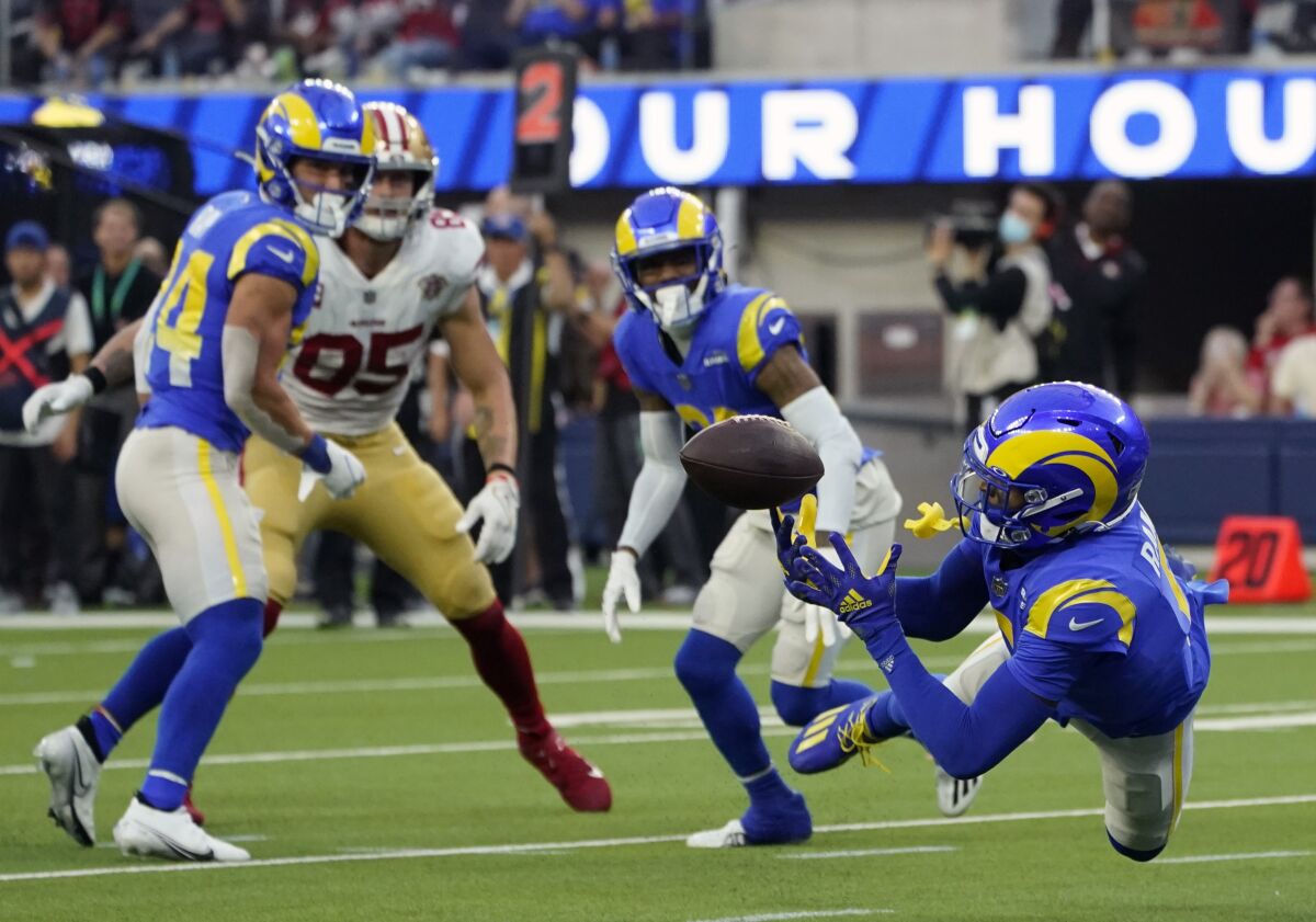 FILE - Los Angeles Rams cornerback Jalen Ramsey, right, intercepts a pass during the second half of an NFL football game against the San Francisco 49ers, Sunday, Jan. 9, 2022, in Inglewood, Calif. On Monday, Feb. 7, 2022, Ramsey said he believes he’s the best defensive back in the NFL, and now he gets his first chance to prove it on the league’s biggest stage at the Super Bowl. (AP Photo/Marcio Jose Sanchez, File)
