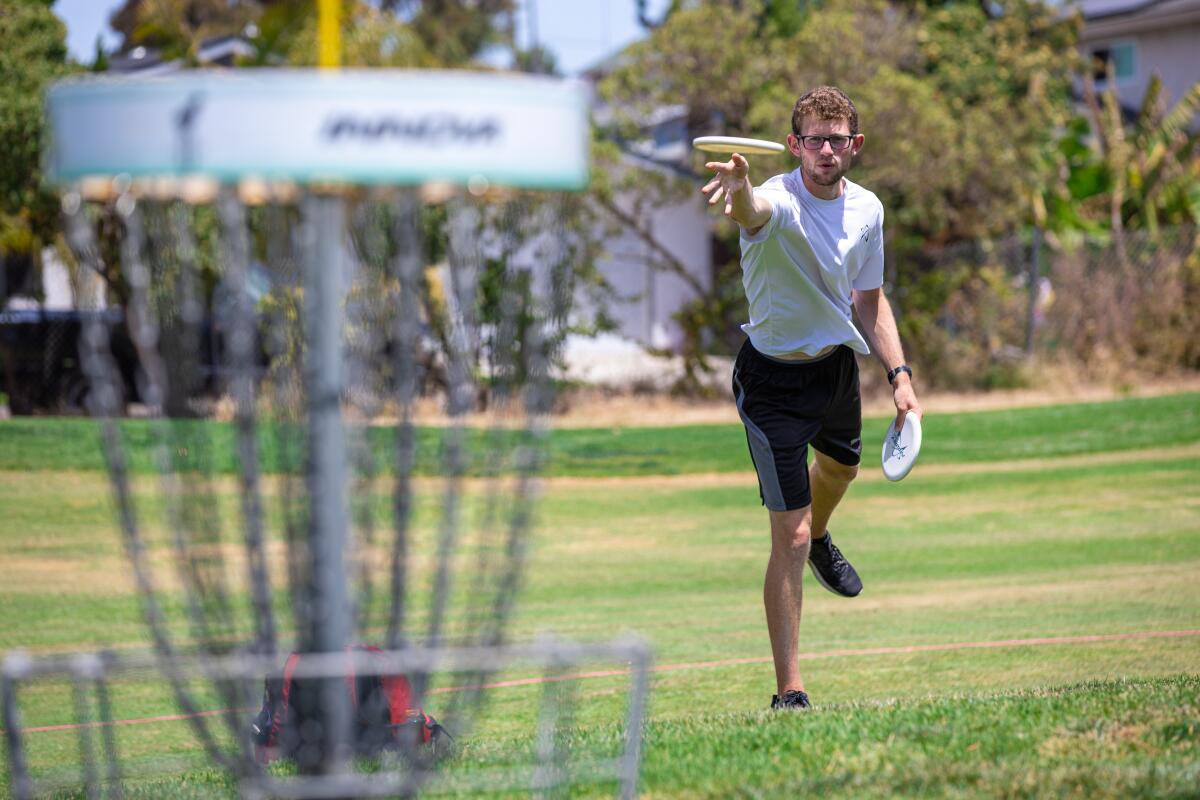 Thomas Gilbert from Toronto practices putting in preparation for this weekend's pro disc golf tournament 