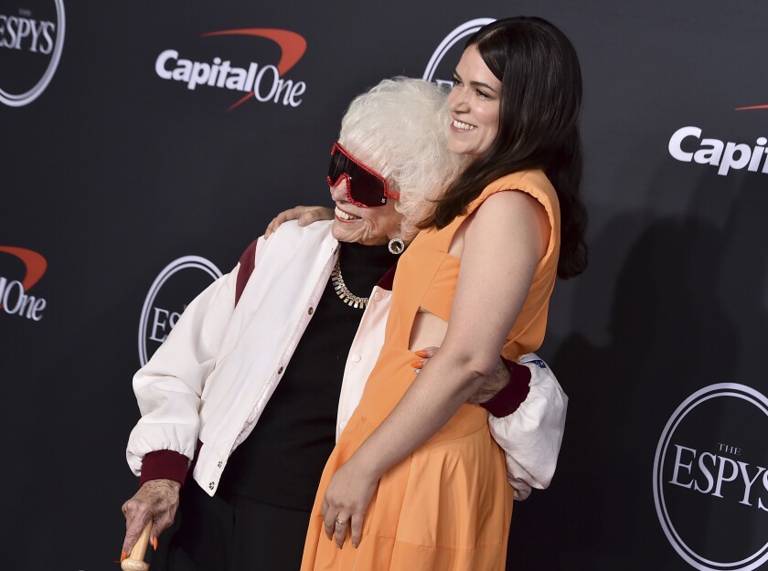 Maybelle Blair, left, and Abbi Jacobson pose arm in arm for the media at the ESPY Awards 