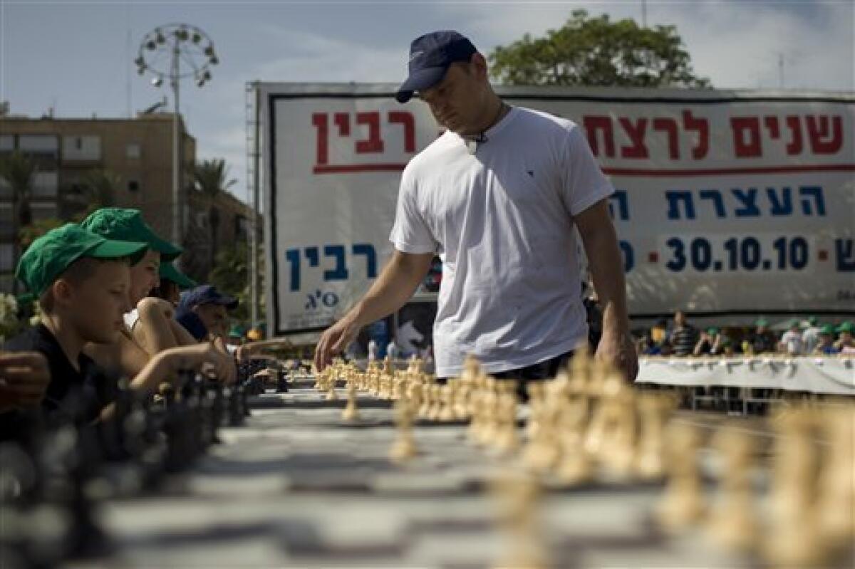 Former world champions take on dozens of chess players in Jerusalem –