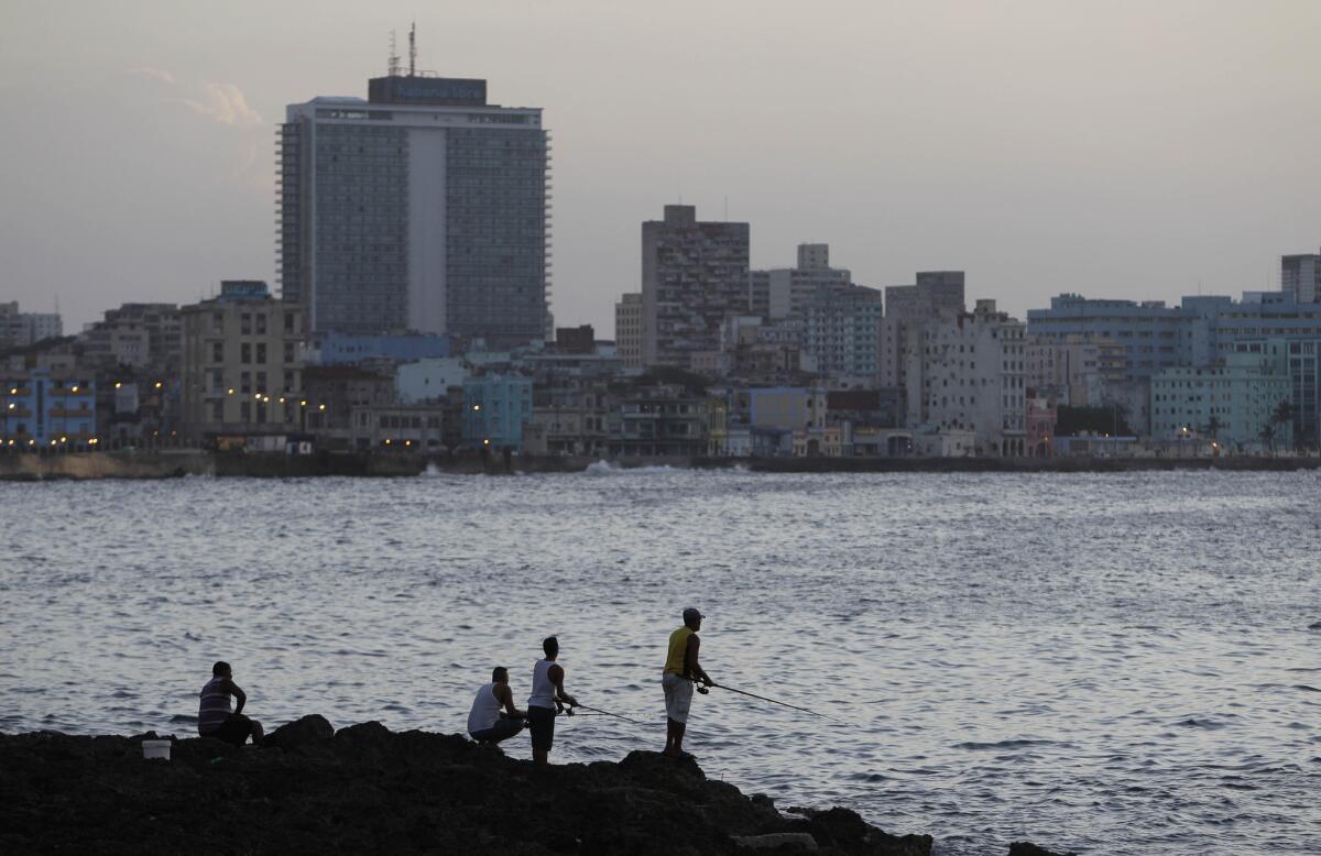 Fishermen cast their lines along the Malecon in Havana. The number of U.S. visitors to Cuba continues to rise.