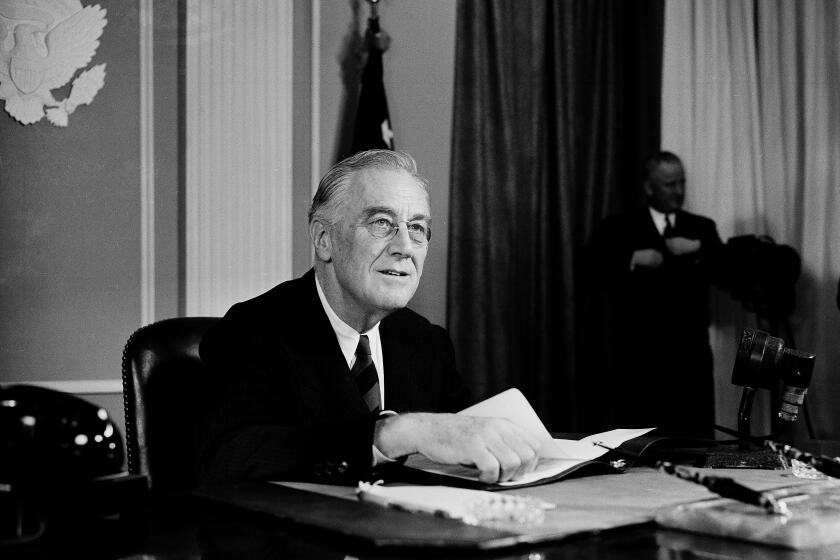 President Franklin D. Roosevelt speaks before a nationwide audience from the East Room of the White House, Nov. 19, 1944, on the eve of the Sixth War Loan campaign, to urge the people to buy more war bonds. He declared the war is costing $250,000,000 a day. (AP Photo/Henry Burroughs)