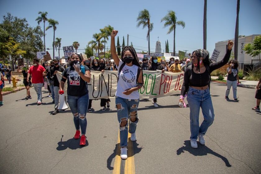 Tatiana Howell, Endiya Griffin and Teija Purvis call for defunding school police in San Diego march