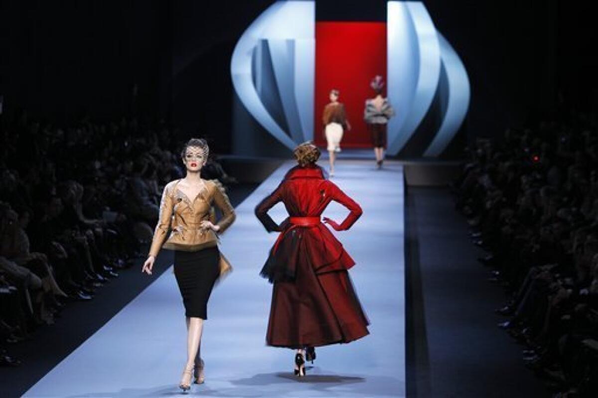 A model displays a creation by fashion designer John Galliano for