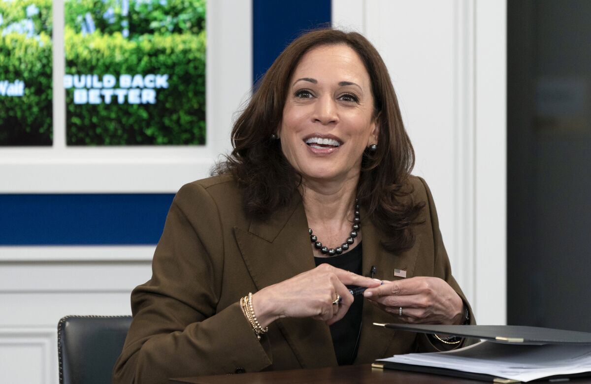 Vice President Kamala Harris, smiles at Sen. Tammy Duckworth, D-Ill., not pictured, at the conclusion of a virtual town hall where they discussed different care policies ranging from at-home medical care to childcare, Thursday, Oct. 14, 2021, in the South Court Auditorium on the White House complex in Washington. (AP Photo/Jacquelyn Martin)