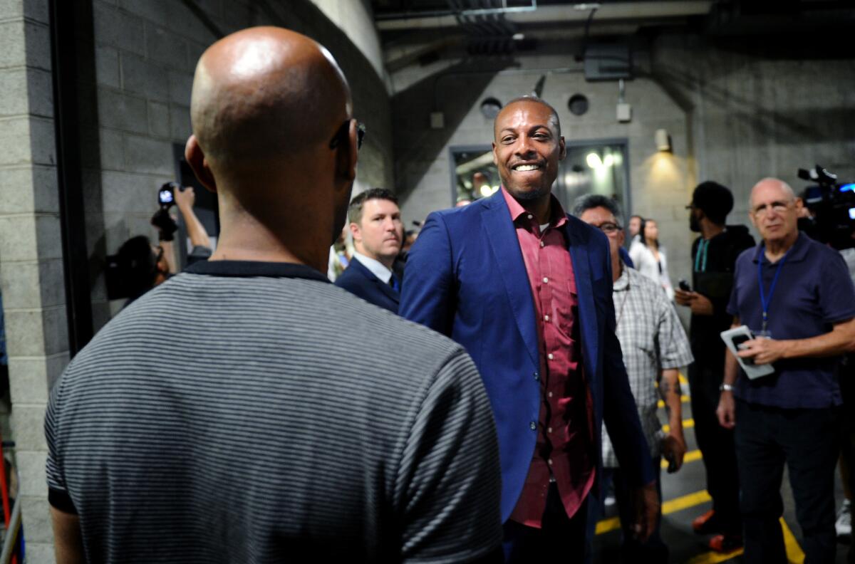 New Clippers forward Paul Pierce talks with assistant coach Sam Cassell after a news conference Tuesday at Staples Center.