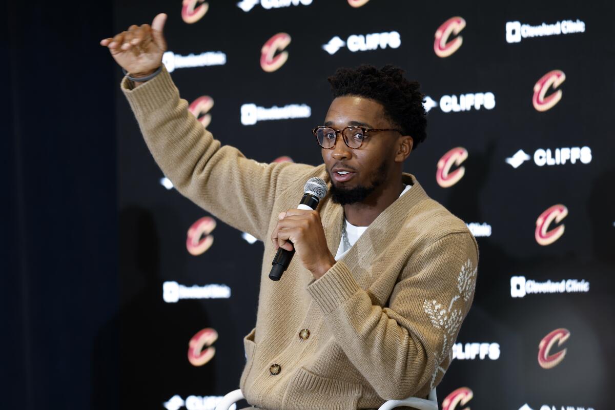 Cleveland Cavaliers guard Donovan Mitchell answers a question during an NBA basketball news conference, Wednesday, Sept. 14, 2022, in Cleveland. (AP Photo/Ron Schwane)