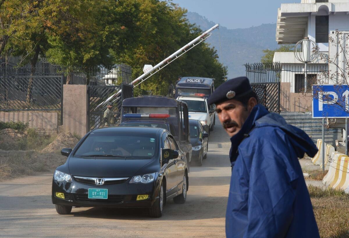 A convoy carrying Pakistani judges leaves the special court building in Islamabad on Wednesday after former military ruler Pervez Musharraf did not show up for his hearing.
