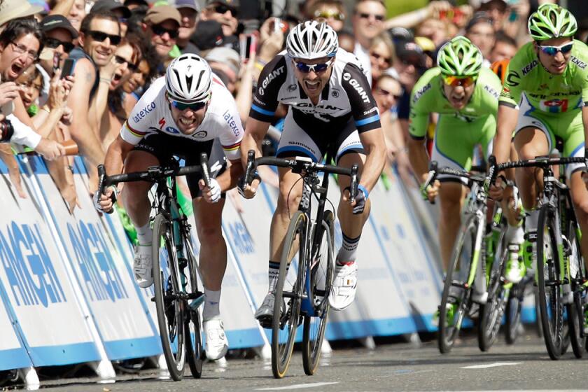 Mark Cavendish, left, edges ahead of John Degenkolb to win the first stage of the 2014 Amgen Tour of California on Sunday in Sacramento.