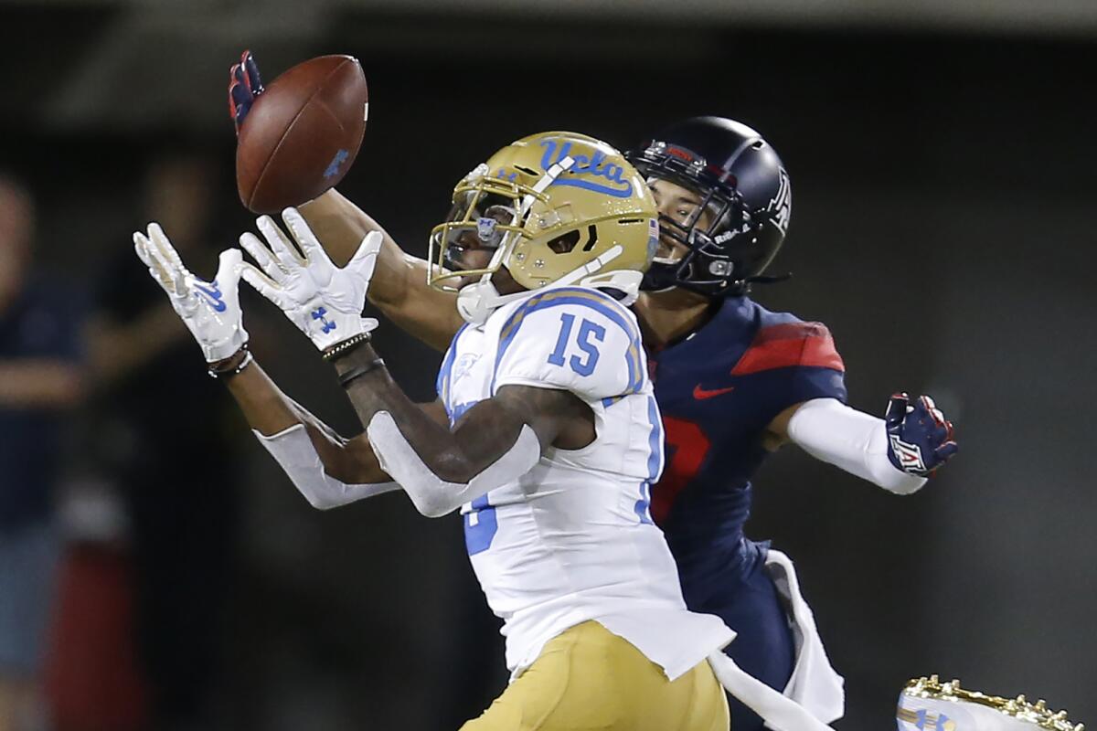 Arizona cornerback Jace Whittaker knocks the ball away from UCLA wide receiver Jaylen Erwin.