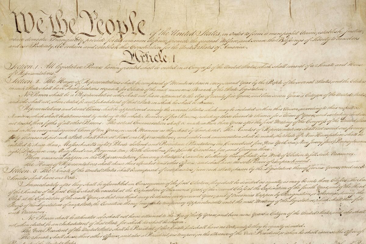 A detail of the first page of the U.S. Constitution.