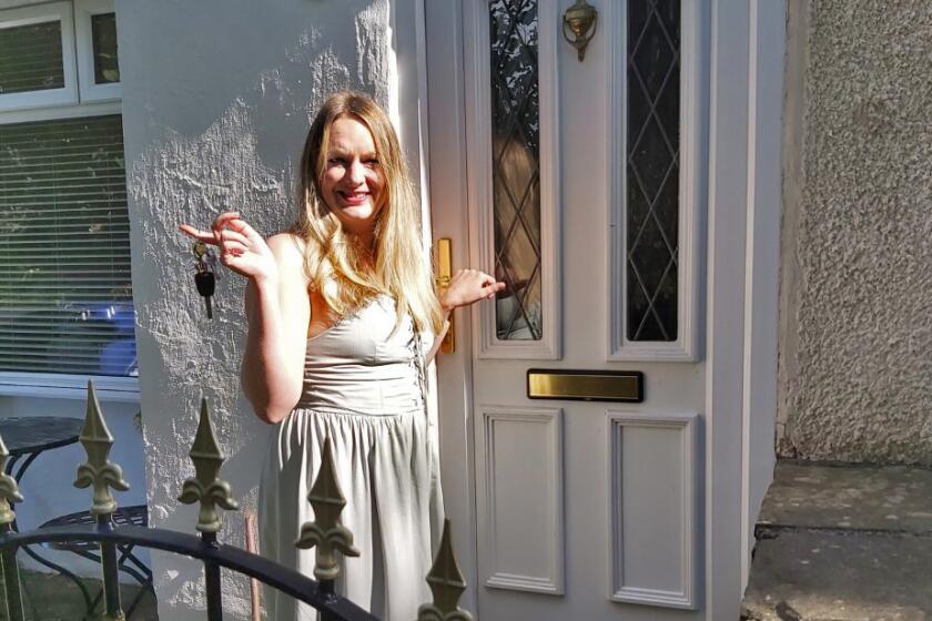 Erica Crompton sits/stands outside her cottage in a small village north of England. Crompton is the author of "The Beginner's Guide to Sanity, a self-help book for people with psychosis."