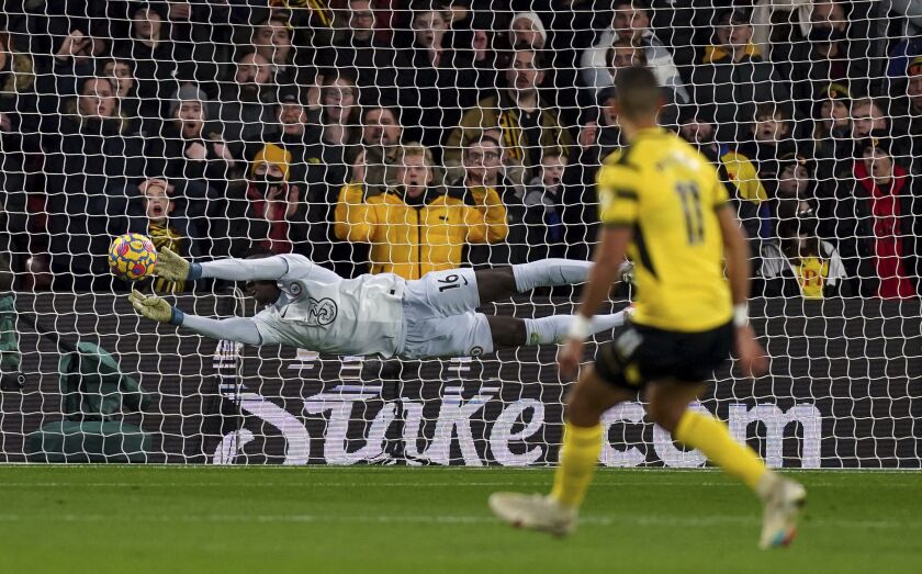 Chelsea goalkeeper Edouard Mendy makes a save during the English Premier League soccer match between Watford and Chelsea at Vicarage Road, Watford, England, Wednesday Dec. 1, 2021. (Mike Egerton/PA via AP)