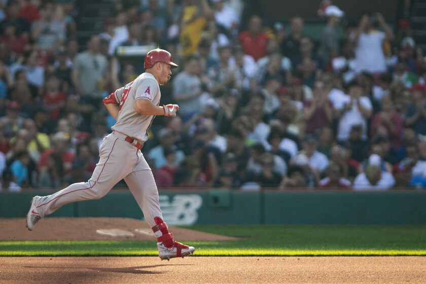 Angels outfielder Mike Trout rounds the bases after hitting a two-run home run against the Boston Red Sox on Aug. 10 at Fenway Park.