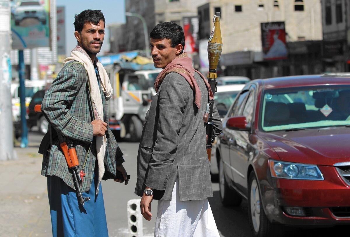 Houthis run a checkpoint near the presidential palace in Sana, Yemen's capital. The rebels, who are pressing for a greater voice in the government, in effect wield the power in Sana.