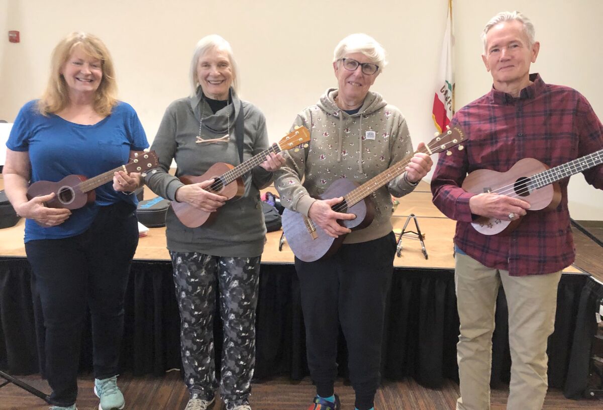 Ukulele students with donated ukuleles are, from left, Jackie Claeys, Darlene MacDonell, Anna Berger-Graham and Russ Harvey.