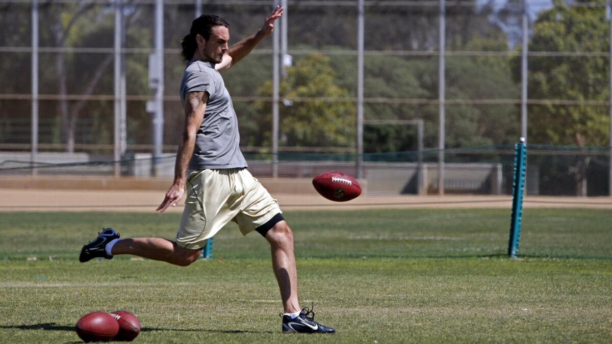Former NFL punter Chris Kluwe practices at Huntington Beach Sports Park in April. Kluwe still practices regularly and hopes he'll get another chance playing in the NFL.