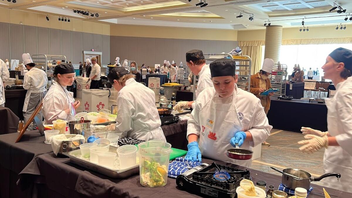 Members of the Newport Harbor High Culinary Team compete Monday at the CA ProStart Cup at the Long Beach Convention Center.