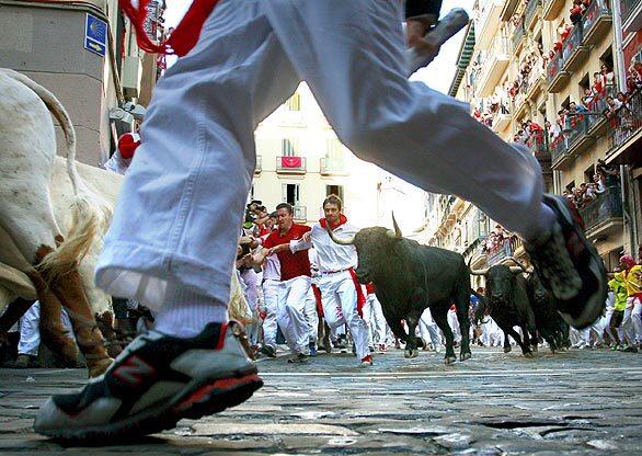 The bulls -- and people -- are on the run at the San Fermín Festival, in Pamplona, Spain. The weeklong fiesta, which is more than 400 years old, features bull runs in the mornings and bullfights in the evenings as well as processions, nightly fireworks and parties.