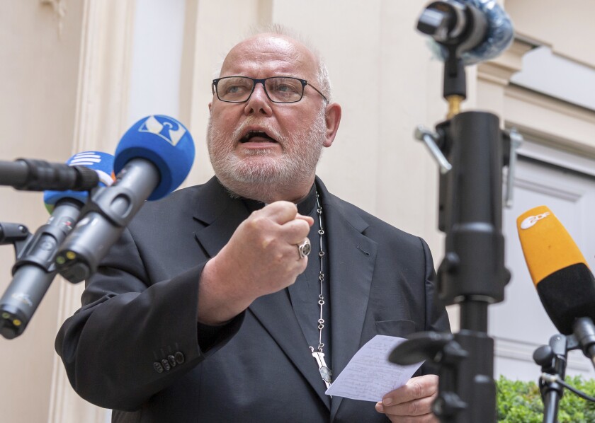 Cardinal Reinhard Marx, Archbishop of Munich and Freising, gives a statement to the press in the courtyard of his residence in Munich, Germany, Friday, June 4, 2021. A leading German cardinal and confidante of Pope Francis has offered to resign over the church’s mishandling of clergy sexual abuse scandals and declared that the church had arrived at “a dead end.” Cardinal Reinhard Marx published his resignation letter to the pope online Friday. (Peter Kneffel/dpa via AP)