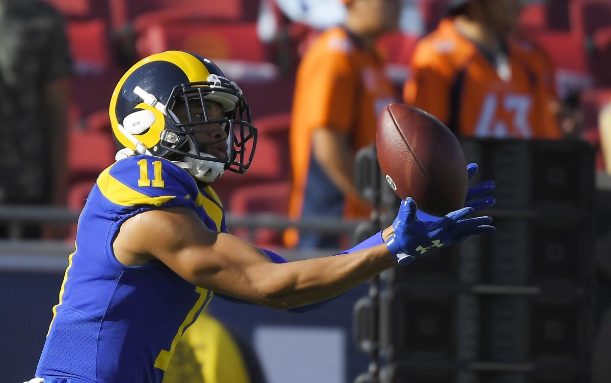 Rams wide receiver KhaDarel Hodge makes a catch in warmups before Saturday's preseason game against the Denver Broncos.