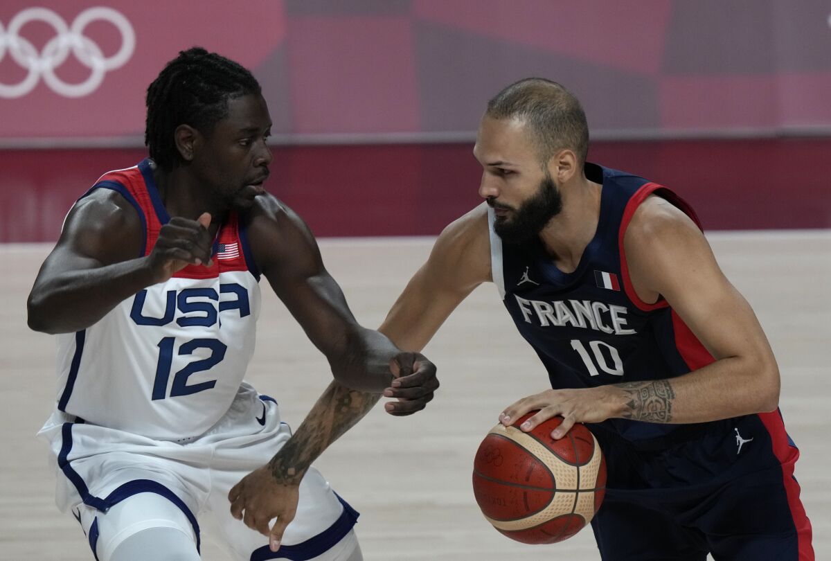 Jrue Holiday defends against Evan Fournier during the men's basketball gold-medal game at the Tokyo Olympics.