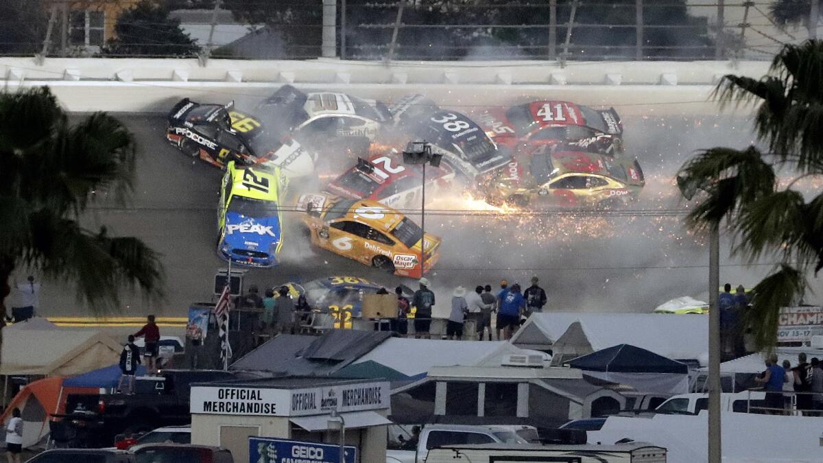 Multiple cars crash during the 2019 Daytona 500. The crash included drivers Austin Dillon (3), Daniel Suarez (41), David Ragan (38), Paul Menard (21), Ryan Newman (6), Aric Almirola (10), Matt DiBenedetto (95) and Ryan Blaney (12).