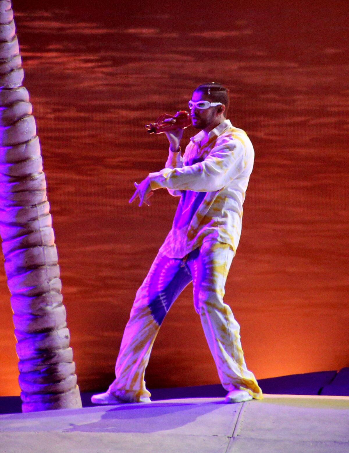 A Latin American singer/rapper performs on stage