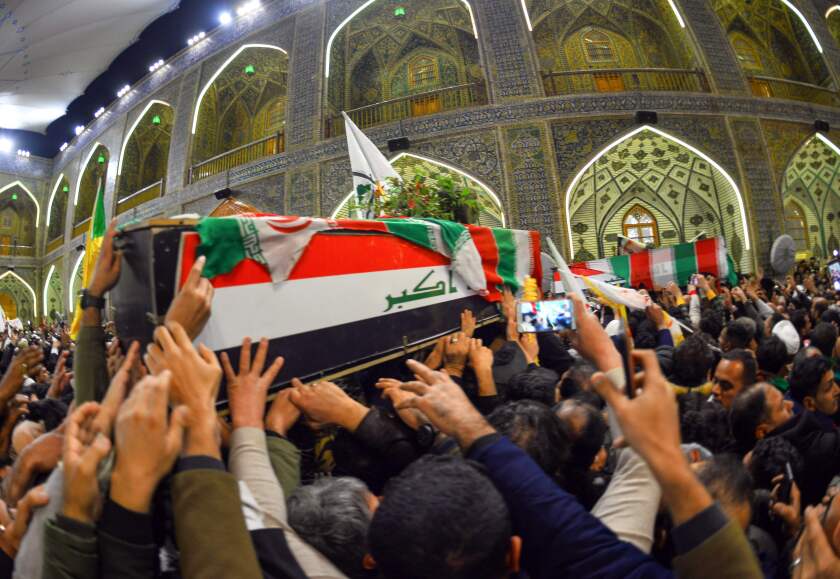Mourners carry the coffins of Iranian Gen. Qassem Suleimani and nine others in Najaf, Iraq, on Jan. 4, 2020.