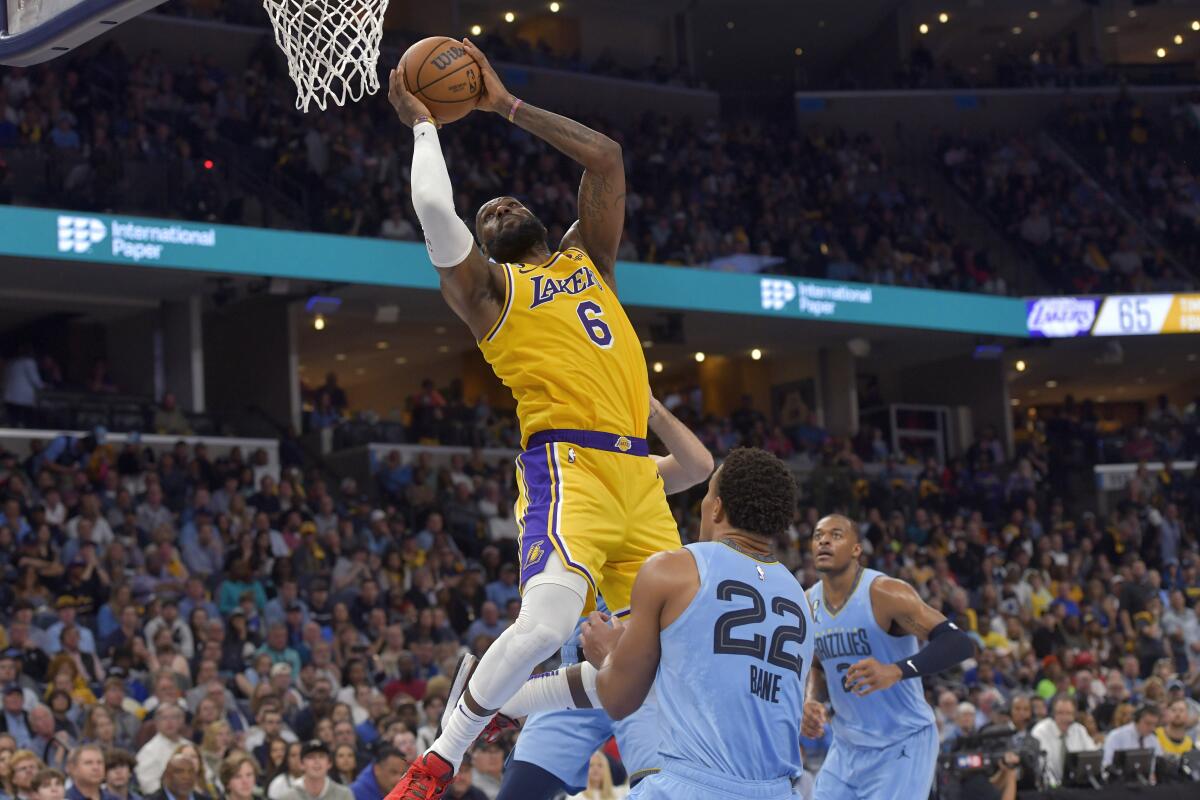 Lakers forward LeBron James shoots over Memphis Grizzlies guard Desmond Bane.