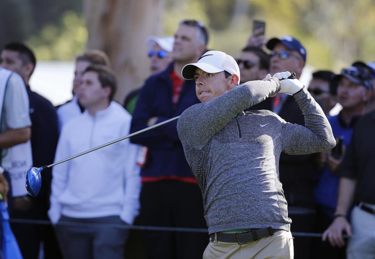 Rory McIlroy hits his tee shot at No. 11 on Friday during the second round of the Northern Trust Open at Riviera Country Club. McElroy is tied with seven others for seventh at six under.