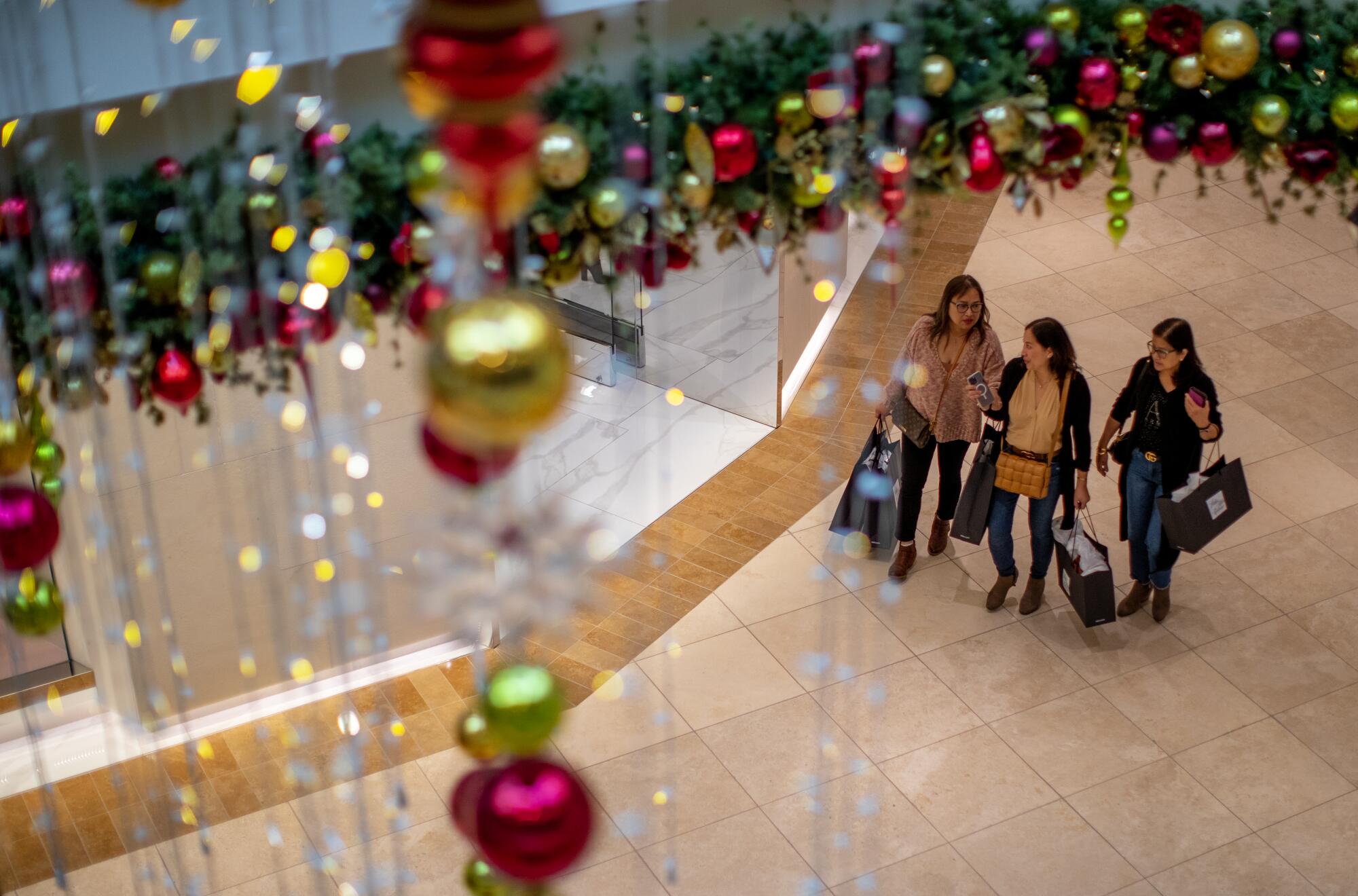 Black Friday shoppers are treated to festive decorations throughout South Coast Plaza.