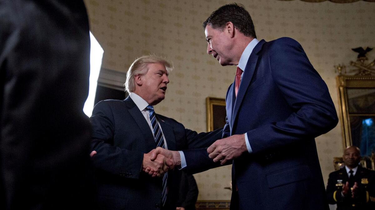 President Trump shakes hands with James Comey on Jan. 22.
