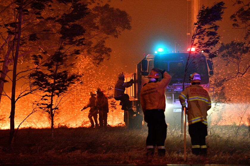 Australian firefighters battle a wildfire near the New South Wales town of Nowra.