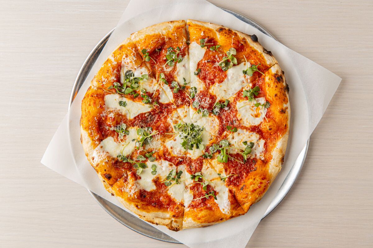 Margherita pizza with San Marzano tomatoes, fresh mozzarella, Grana Padano, basil and olive oil at 3rd Base in Hollywood