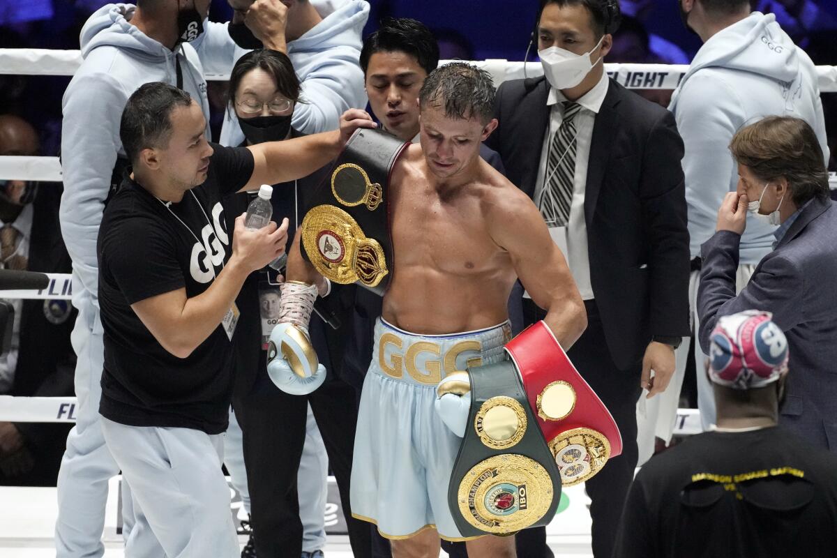 Gennadiy Golovkin of Kazakhstan holds his champion belts after WBA/IBF middleweight unification boxing title match with Ryota Murata of Japan in Saitama, near Tokyo, Saturday, April 9, 2022. (AP Photo/Shuji Kajiyama)