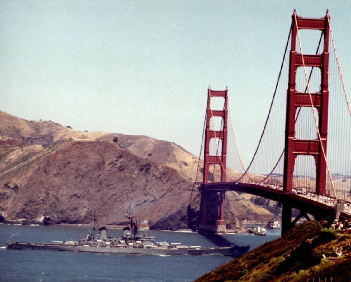 A photo from the late sixties shows a battleship passing under the Golden Gate Bridge.
