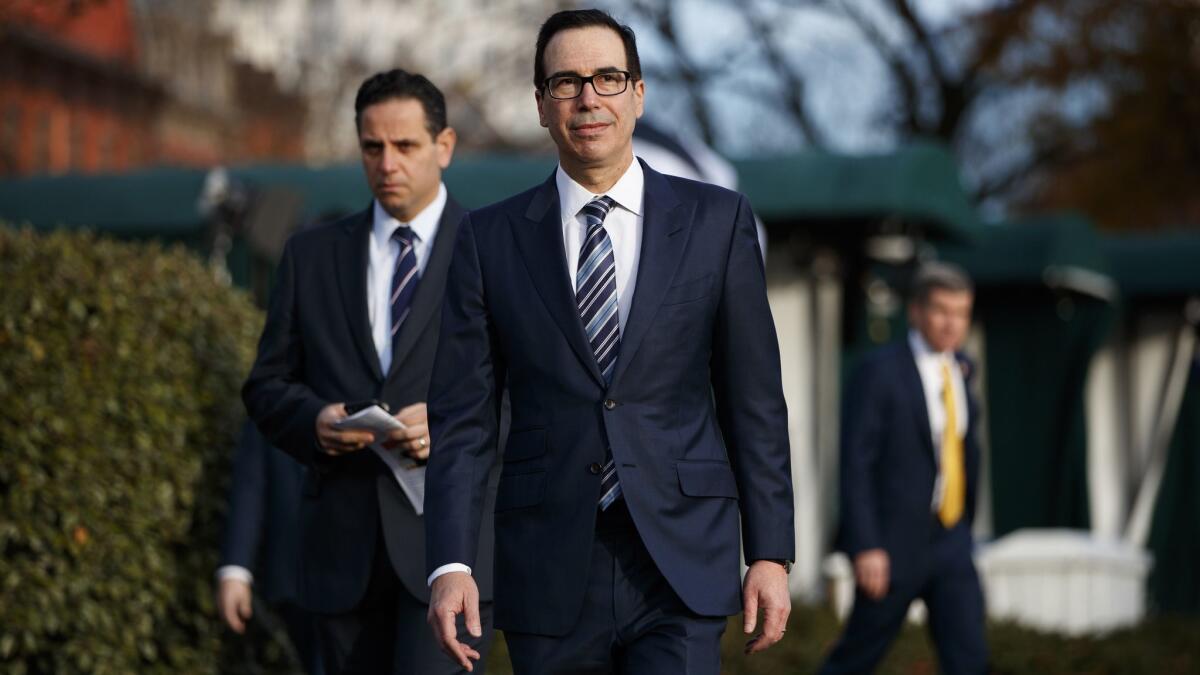Treasury Secretary Steven T. Mnuchin walks over to talk with reporters about trade negotiations with China at the White House in December.