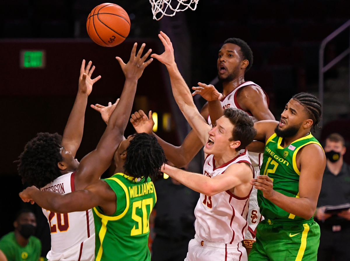 USC and Oregon players battle for the ball during the Trojans' win at Galen Center on Feb. 22.